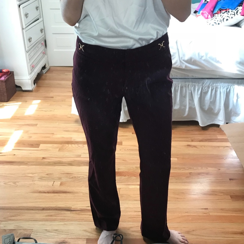 Maroon dress pants with gold accents at the hip